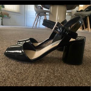 black patent leather prada heels with ankle strap